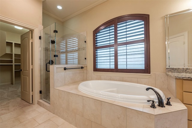 bathroom featuring separate shower and tub, ornamental molding, vanity, and tile patterned flooring