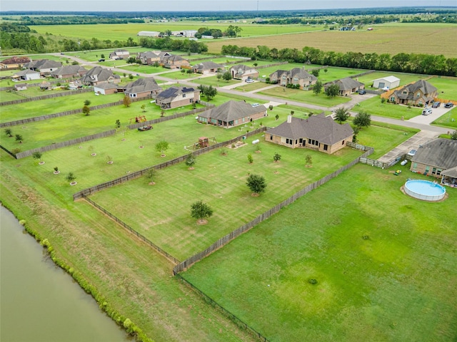 aerial view featuring a rural view and a water view