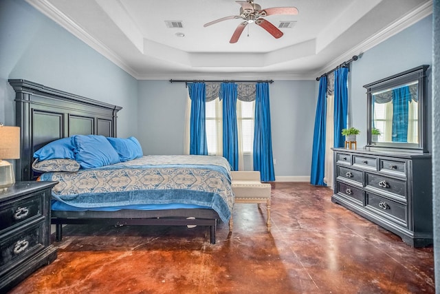 bedroom featuring multiple windows, a raised ceiling, and ceiling fan