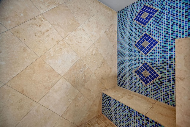 bathroom with tiled shower