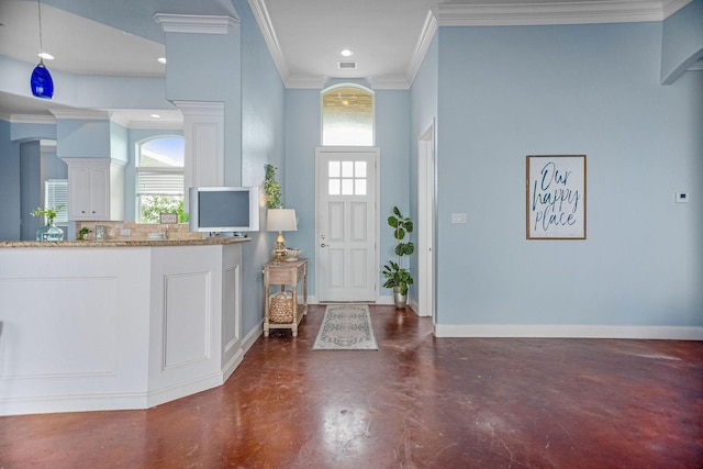 foyer entrance featuring ornamental molding