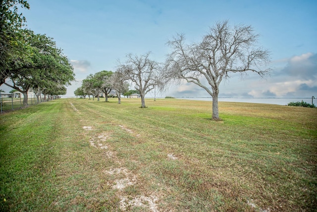 view of yard featuring a rural view and a water view