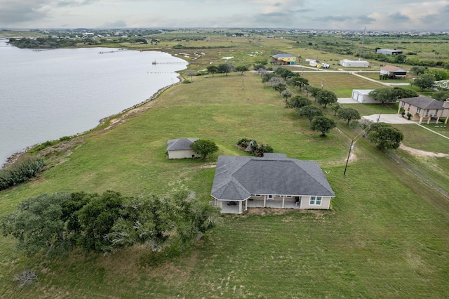 aerial view with a rural view and a water view