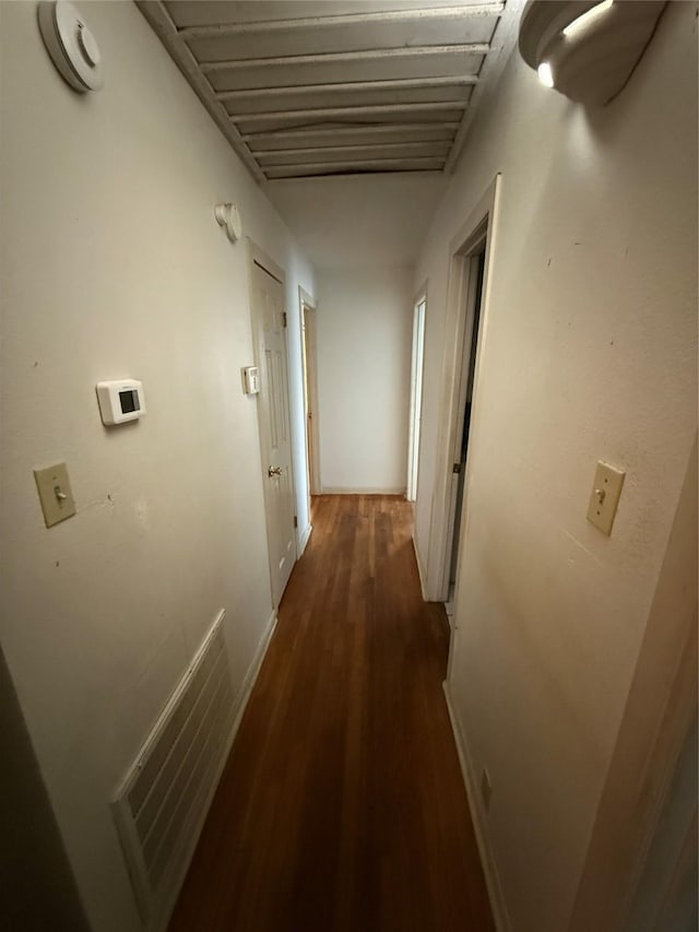 hallway featuring dark hardwood / wood-style floors