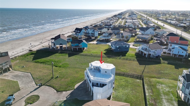 birds eye view of property featuring a water view and a view of the beach