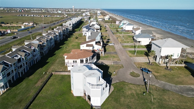 aerial view featuring a water view and a beach view