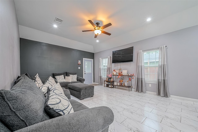 living room with ceiling fan and lofted ceiling