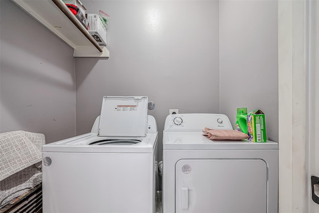 laundry area with washing machine and clothes dryer