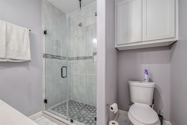 bathroom featuring walk in shower and toilet