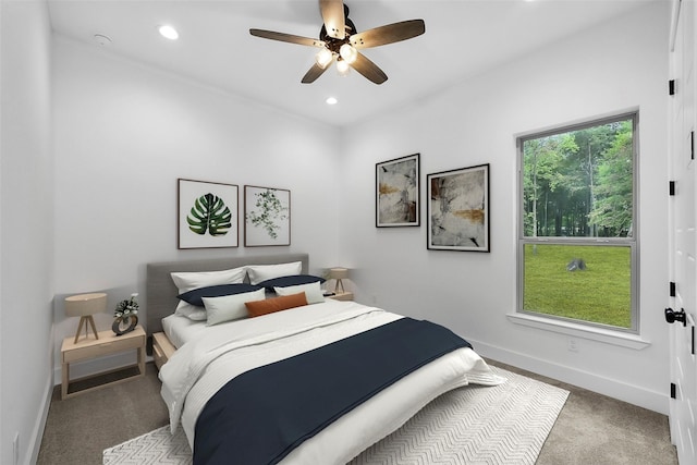 carpeted bedroom with ceiling fan