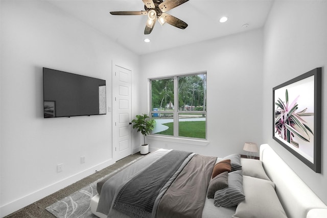 carpeted bedroom featuring ceiling fan