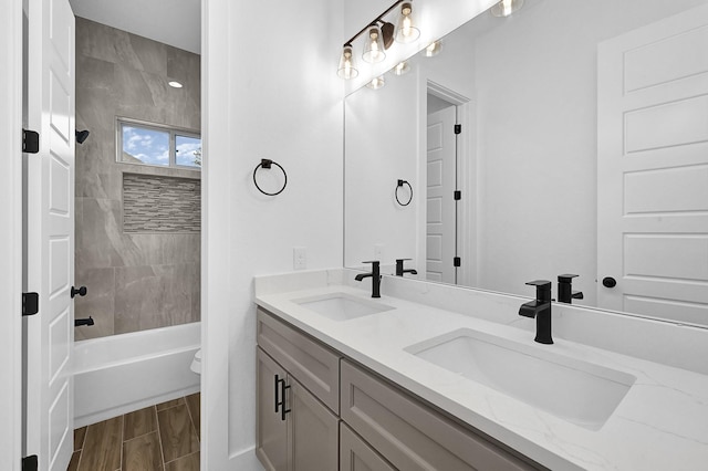 full bathroom with vanity, shower / bathtub combination, and toilet