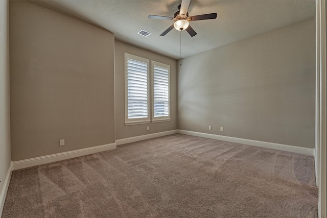 carpeted empty room featuring ceiling fan