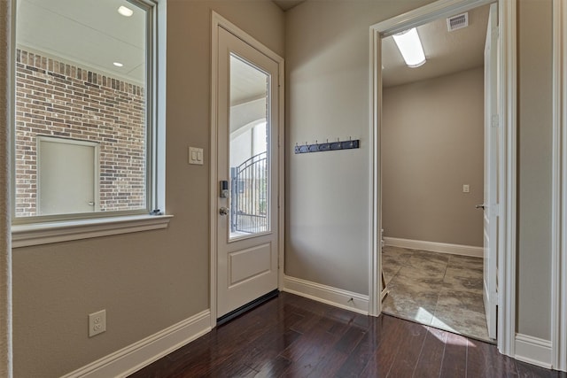 doorway to outside featuring dark hardwood / wood-style floors