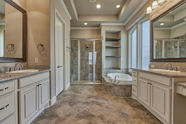 full bath with crown molding, a stall shower, a garden tub, and a sink