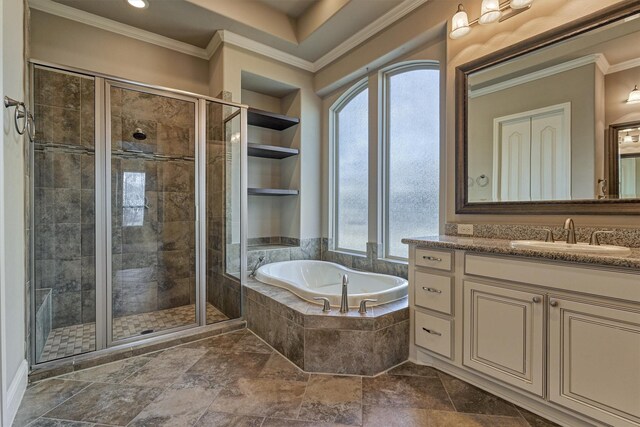 bathroom with ornamental molding, shower with separate bathtub, vanity, and built in features