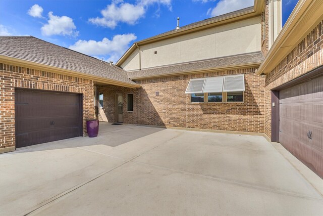 view of side of home featuring a garage