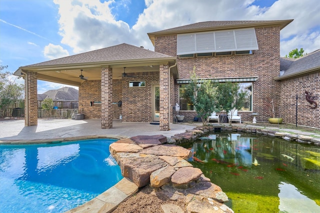 view of swimming pool featuring a ceiling fan, a fenced in pool, a patio, and fence