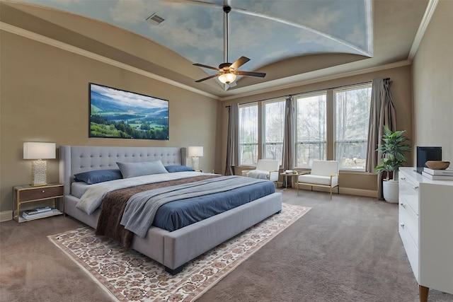 bedroom featuring baseboards, visible vents, ornamental molding, a tray ceiling, and carpet flooring