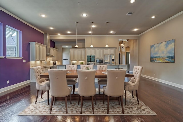 dining room featuring ornamental molding, dark wood finished floors, and baseboards