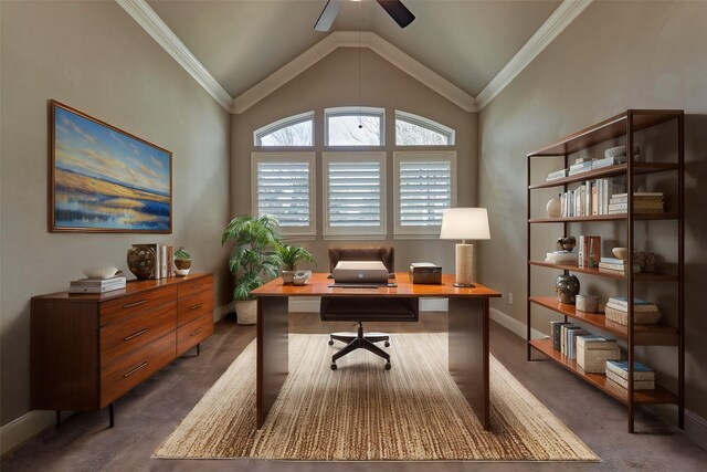 carpeted home office with lofted ceiling, ceiling fan, ornamental molding, and baseboards