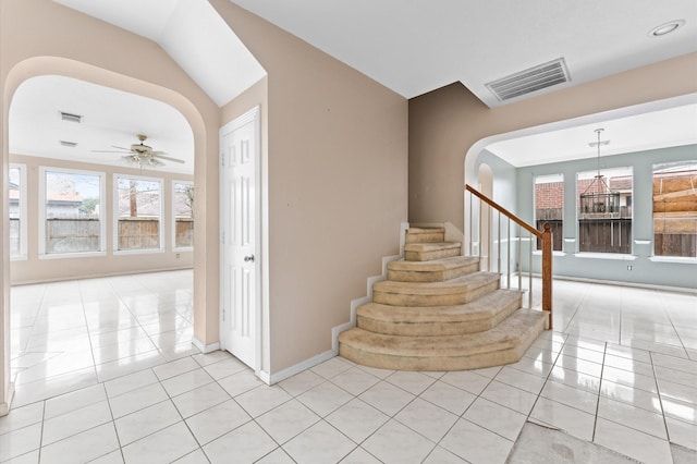 tiled foyer entrance with ceiling fan