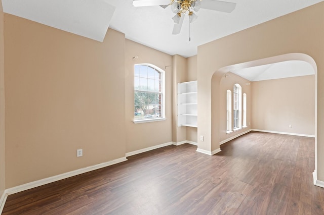 spare room featuring ceiling fan and dark hardwood / wood-style floors