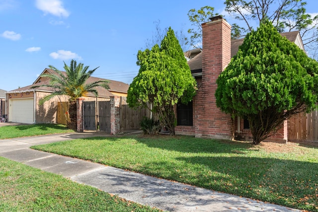 obstructed view of property with a garage and a front yard