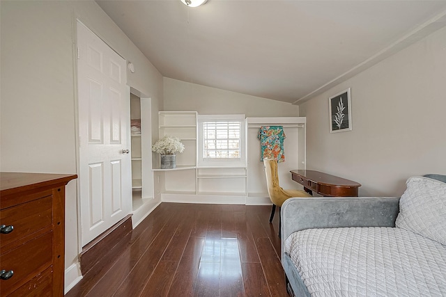 bedroom with dark hardwood / wood-style flooring and vaulted ceiling