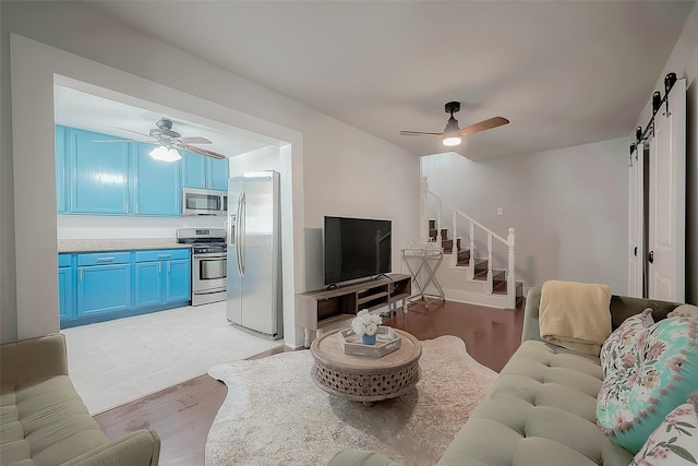 living room featuring a barn door