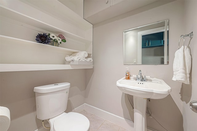 bathroom with tile patterned floors and toilet