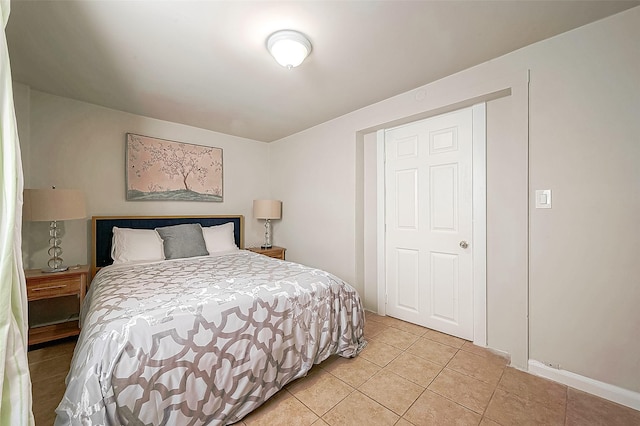 bedroom with light tile patterned floors