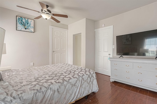 bedroom featuring ceiling fan and dark hardwood / wood-style floors