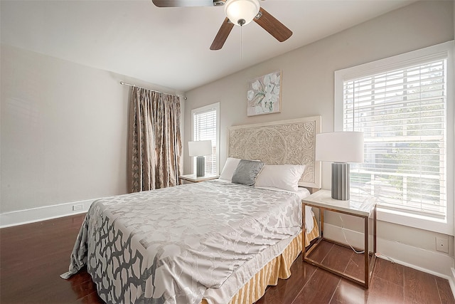 bedroom featuring ceiling fan and dark wood-type flooring