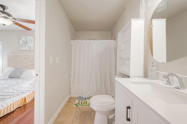 bathroom with ceiling fan, toilet, and vanity