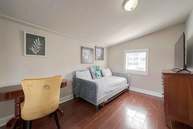 bedroom featuring dark hardwood / wood-style floors and lofted ceiling