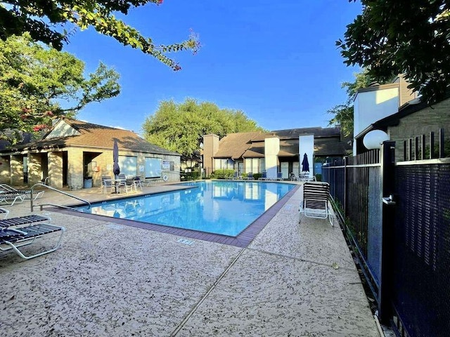 view of swimming pool with a patio area