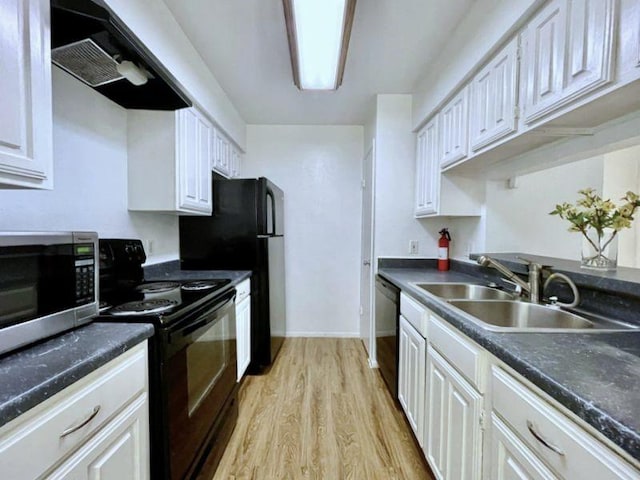 kitchen featuring white cabinetry, sink, black appliances, and range hood