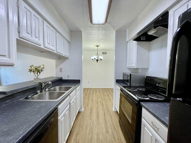 kitchen with black appliances, white cabinets, sink, light hardwood / wood-style flooring, and a chandelier