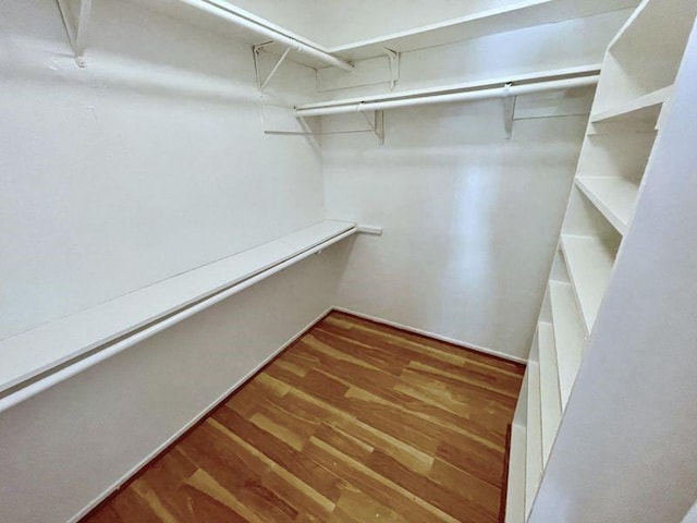 walk in closet featuring hardwood / wood-style flooring