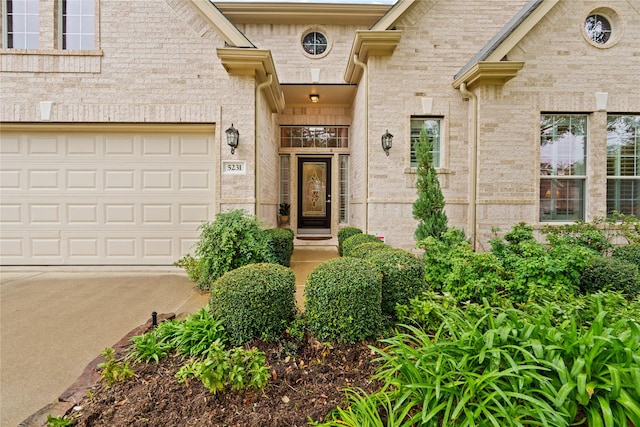 view of exterior entry with a garage