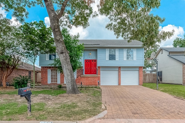 raised ranch featuring a garage