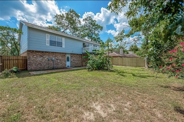 back of house with a lawn