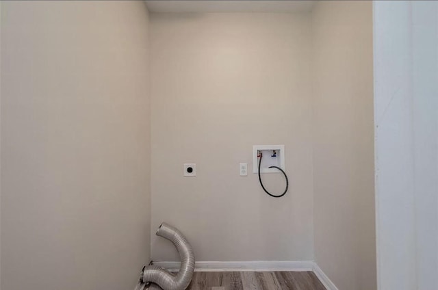 washroom featuring wood-type flooring, washer hookup, and hookup for an electric dryer