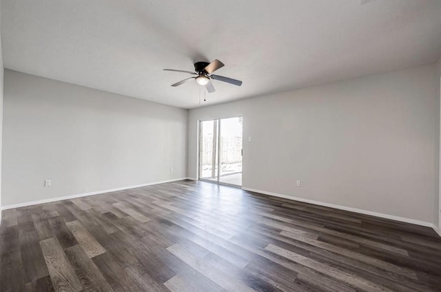 unfurnished room with ceiling fan and dark wood-type flooring