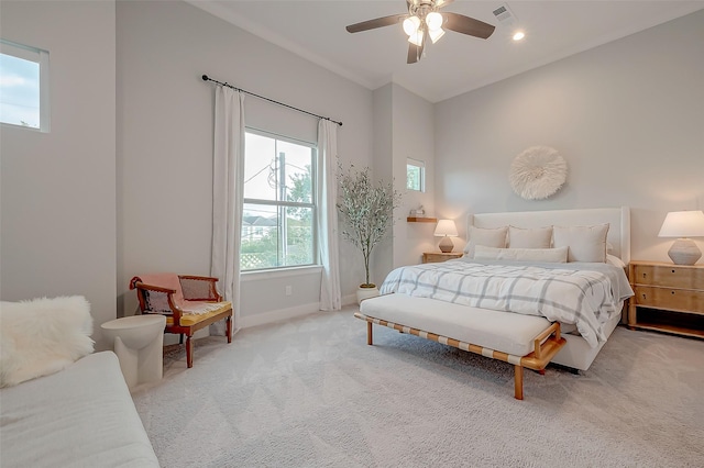 bedroom featuring light carpet and ceiling fan