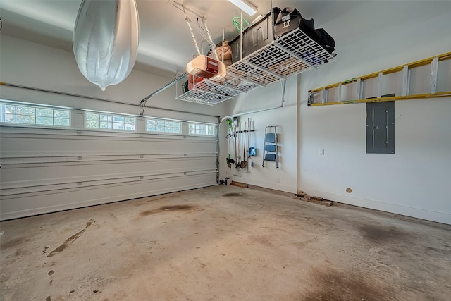 garage featuring a garage door opener and electric panel