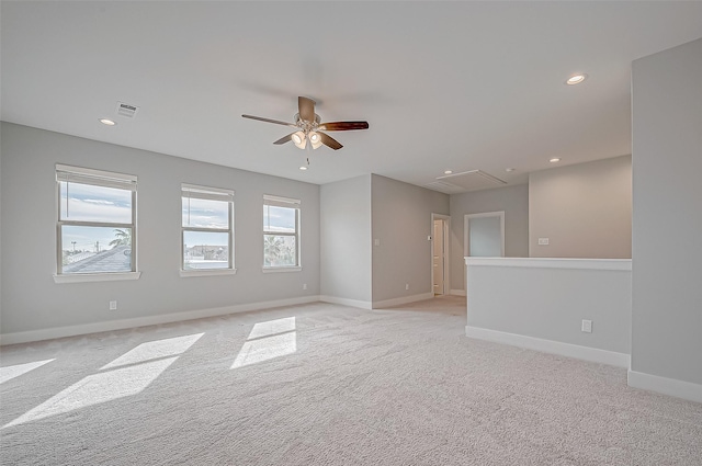 carpeted spare room with ceiling fan