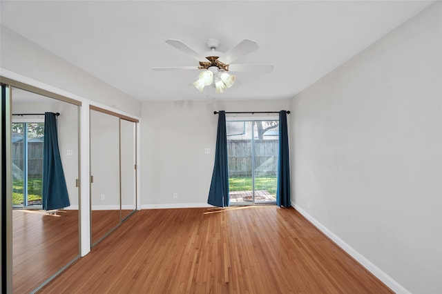 unfurnished room featuring hardwood / wood-style flooring and ceiling fan