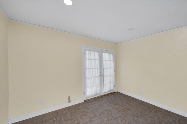 spare room with crown molding and french doors